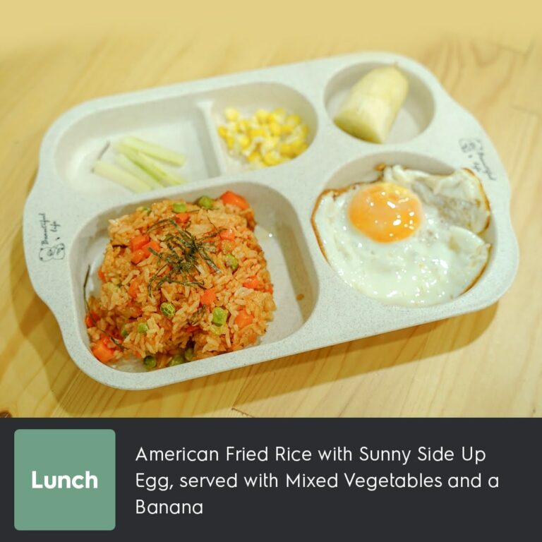 American Fried Rice with Sunny Side Up Egg, served with Mixed Vegetables and a Banana-min