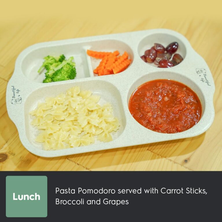 Pasta Pomodoro served with Carrot Sticks, Broccoli and Grapes-min